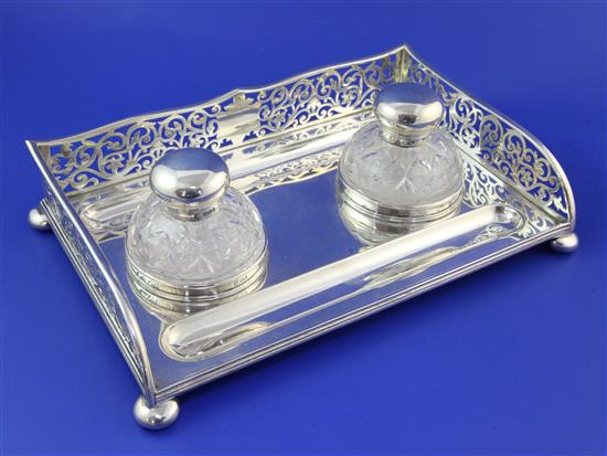 A George V silver rectangular inkstand by Thomas Bradbury & Sons, 30 oz.